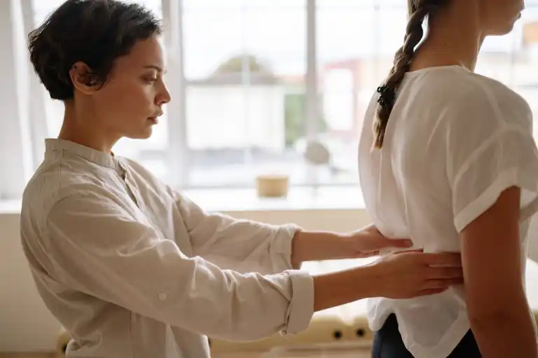 Doula supporting a woman with gentle hands-on care
